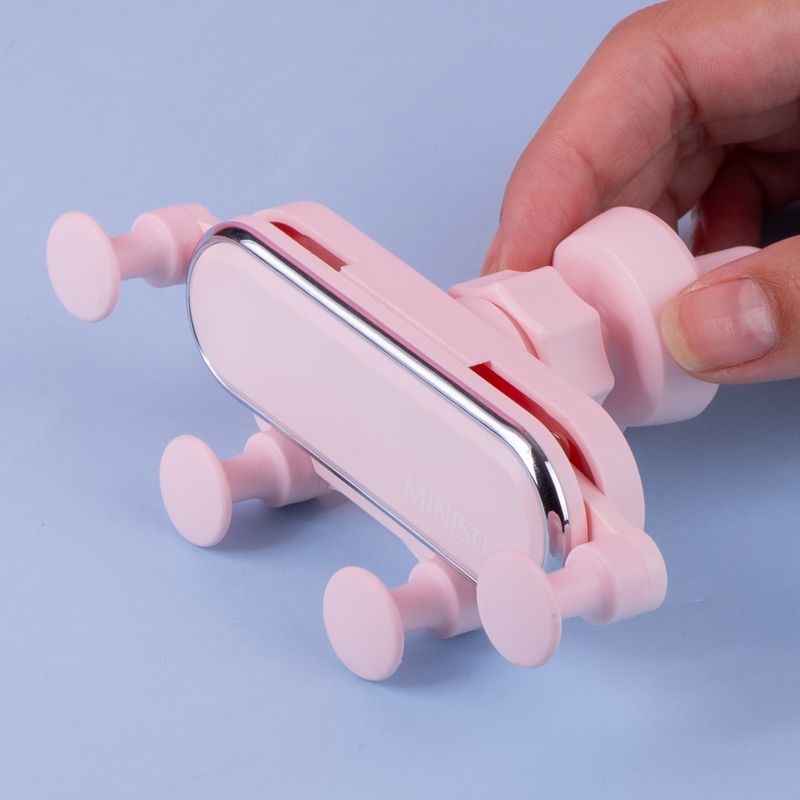 Soporte-de-celular-para-auto-gravedad-macaron-rosa-Miniso-2-21891