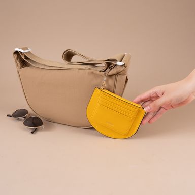 Monedero media luna sintético amarillo 13x10 cm -  Miniso